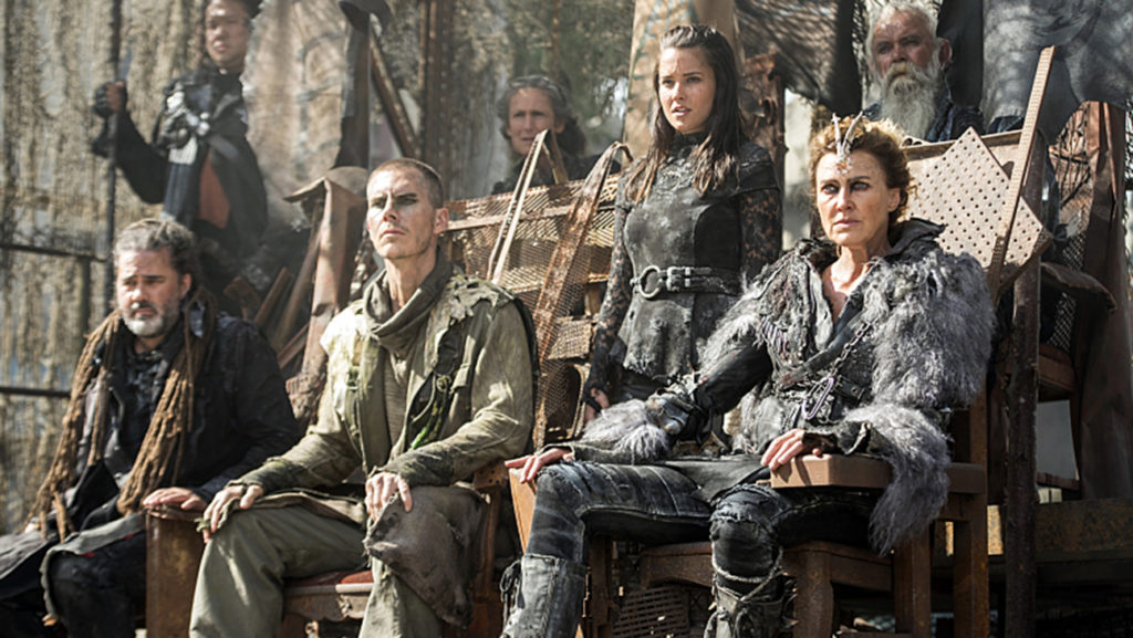 The 100 -- "Watch The Thrones" -- ImageÃÂ HU304a_0225 -- Pictured (Center L-R): Rhiannon Fish as Ontari (Standing) and Brenda Strong as Nia -- Credit: Cate Cameron/The CW -- ÃÂ© 2016 The CW Network, LLC. All Rights Reserved